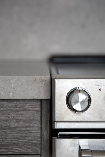 Stainless-steel kitchenaid® appliances including a 5-burner range and built-in microwave